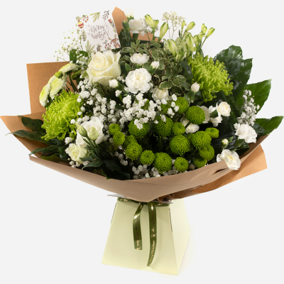 Joy to the World - This dreamy white and green hand-tied Christmas design evokes the spirit of the season in flowers. The perfect way to share joy this festive season.
